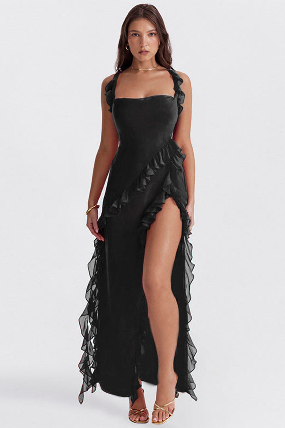 Model wearing black fringe maxi dress with thigh split