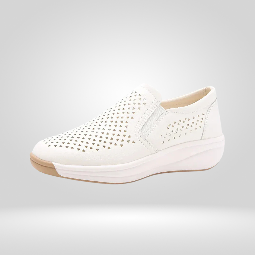 White cut-out slip-on platform shoe, side view