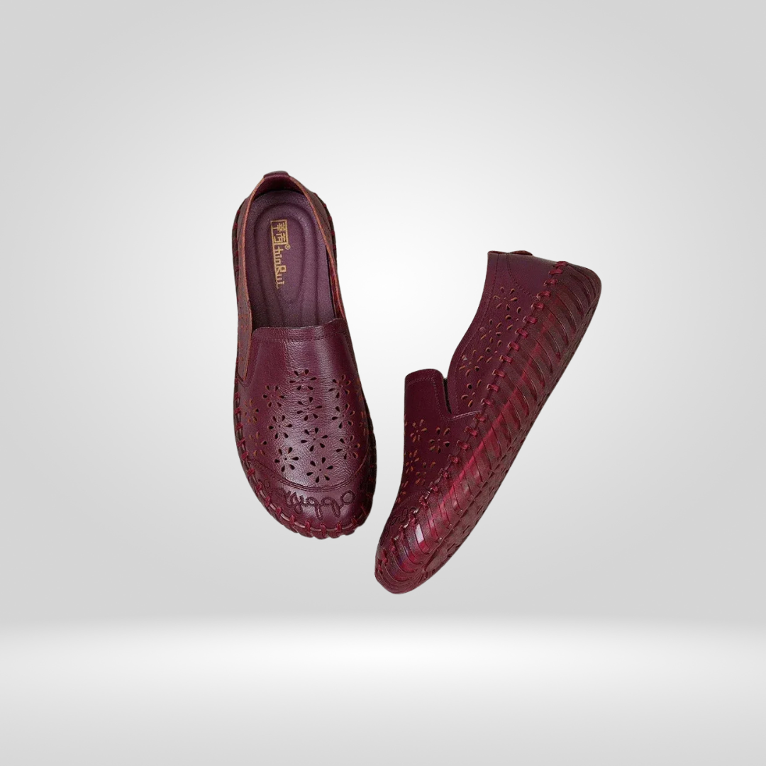 Pair of burgundy leather loafers, side view