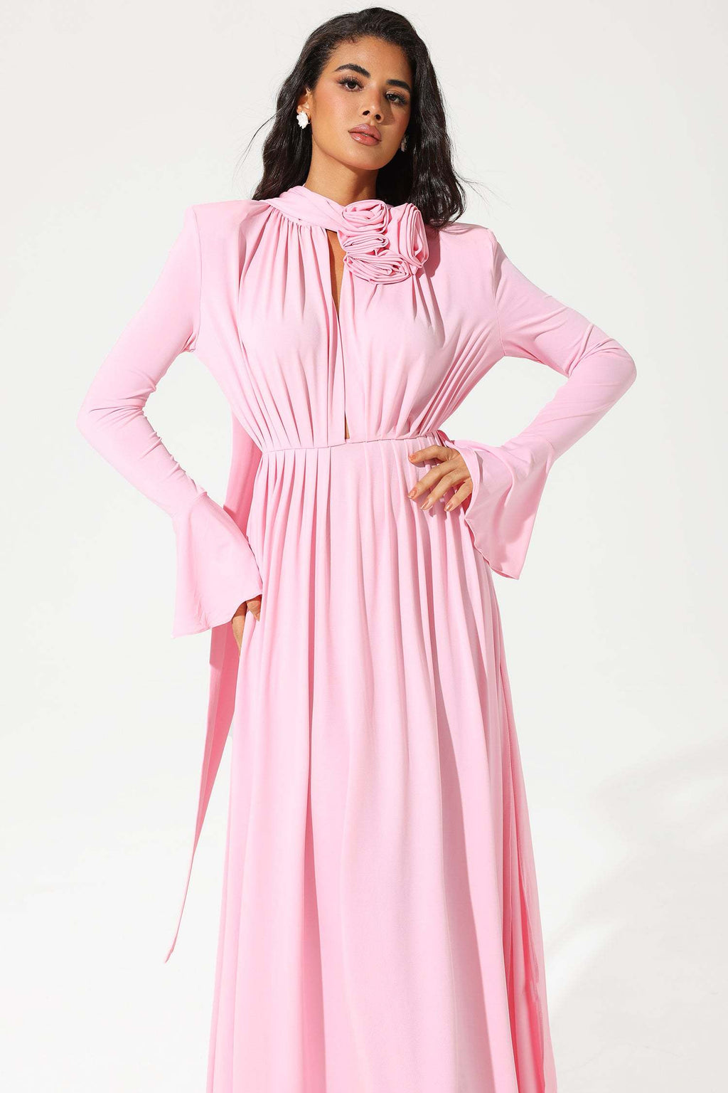 Model wearing pink dress, walking pose