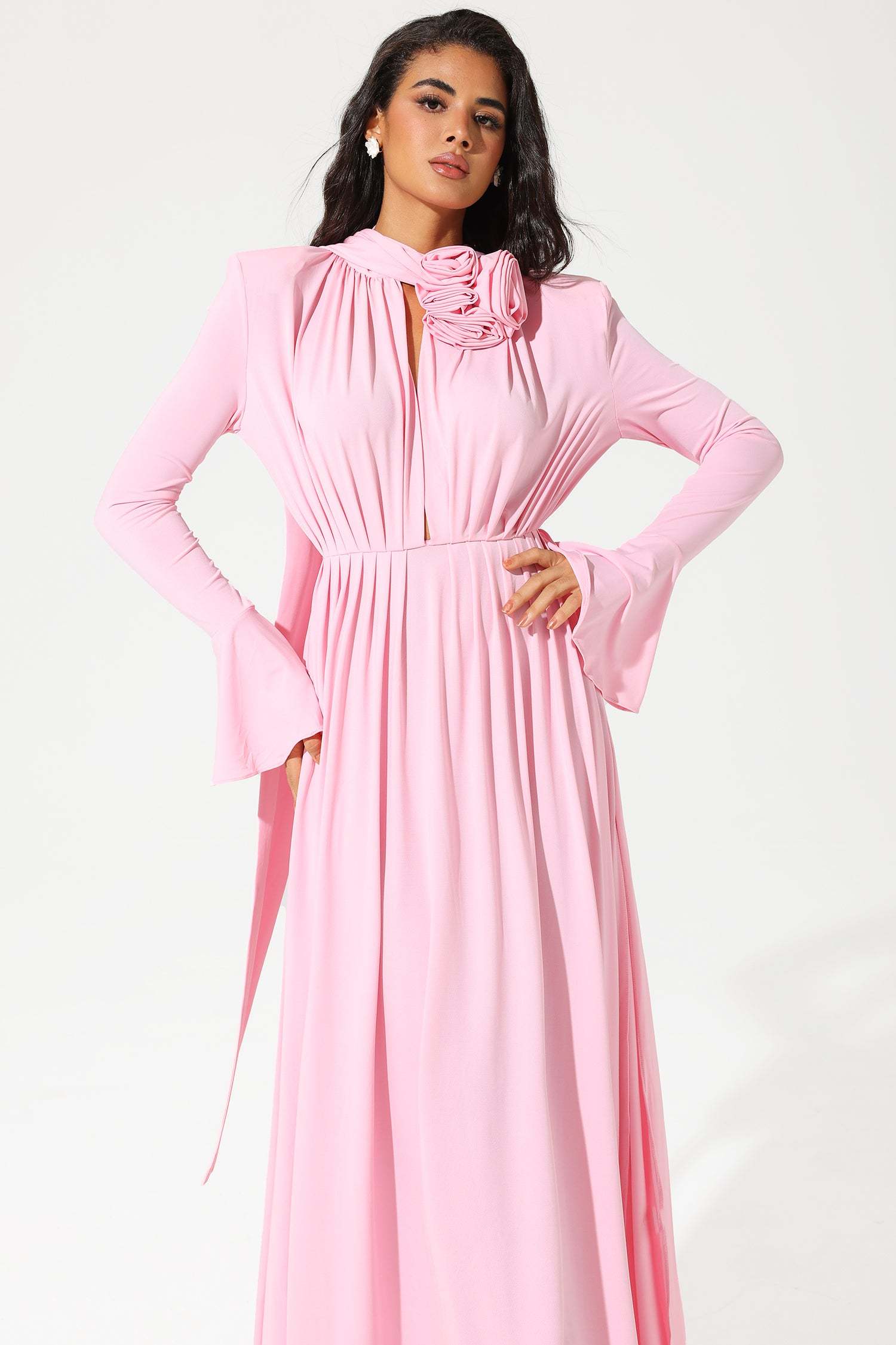 Model wearing pink dress, walking pose