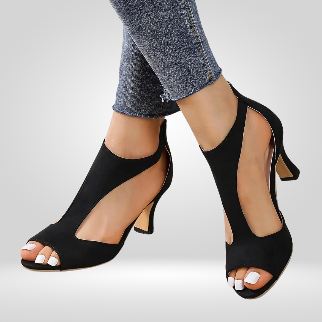 Black ankle-strap heeled sandals, side view