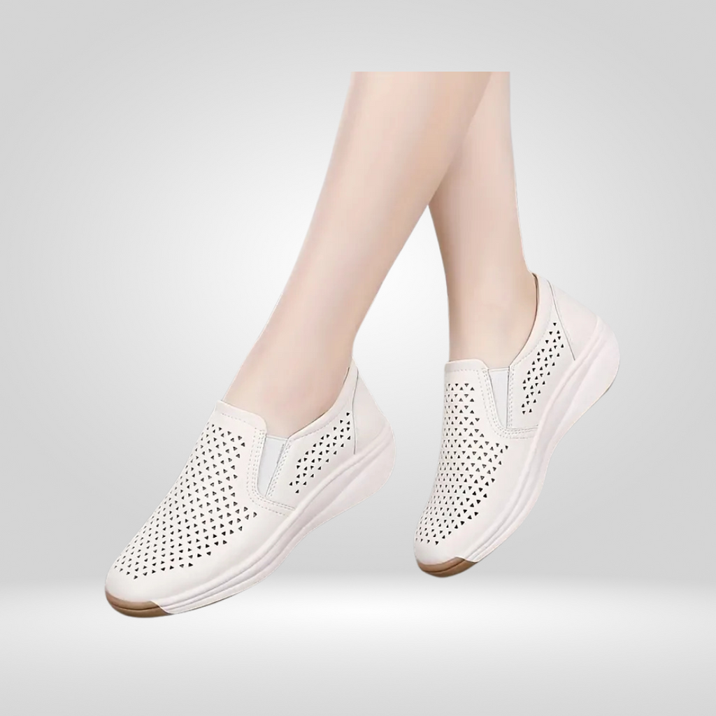 Model wearing white cut-out platform shoes, side view
