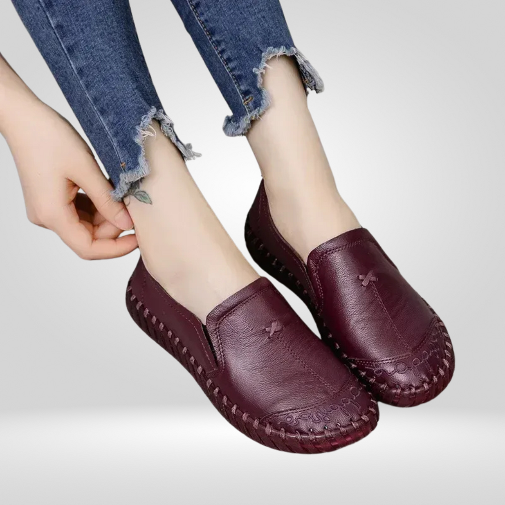 Model putting on burgundy leather loafer
