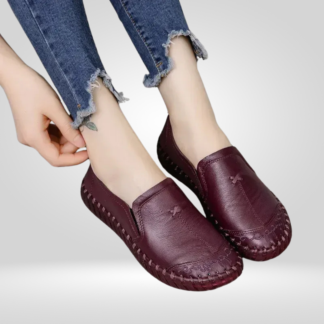 Model putting on burgundy leather loafer