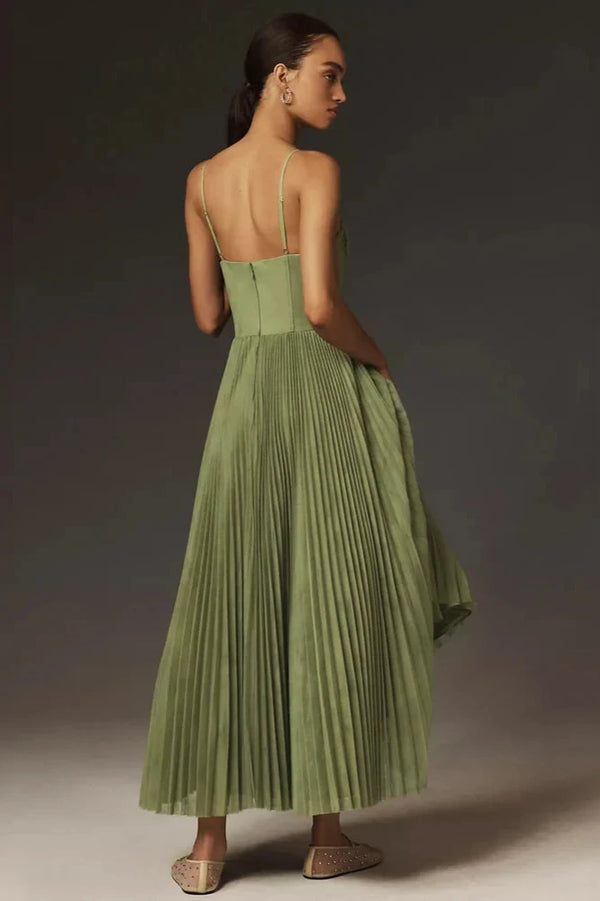 Model walking in sage green tulle midi dress, side view