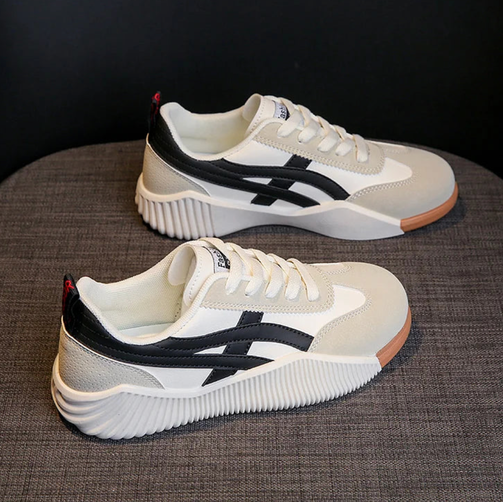 Beige and black sneakers, pair side by side