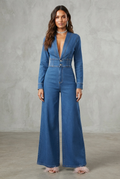 Medium blue denim jumpsuit with plunge V-neck, corset waist and wide leg palazzo pants front view - Velara UK