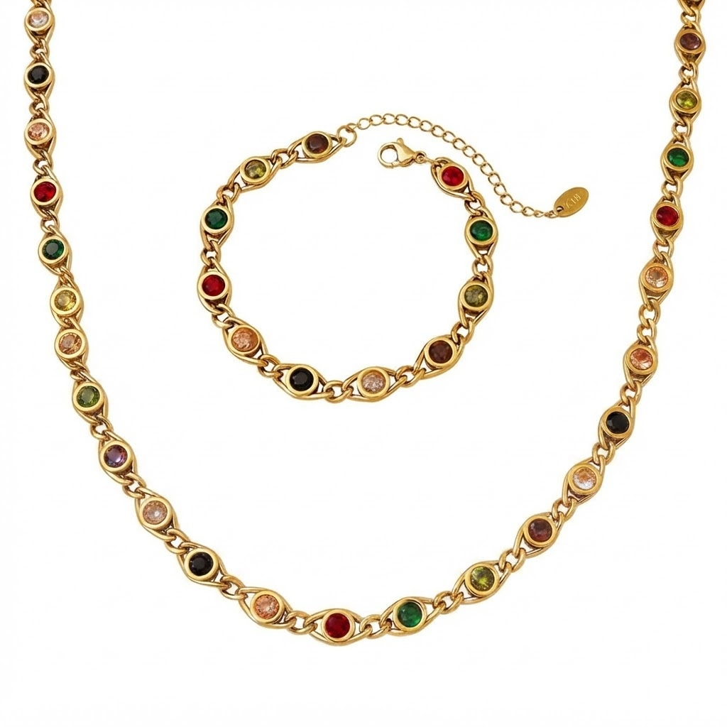 Gold-tone jewelry set with round bezel-set multicolored gemstones and cable chain links displayed flat on white background