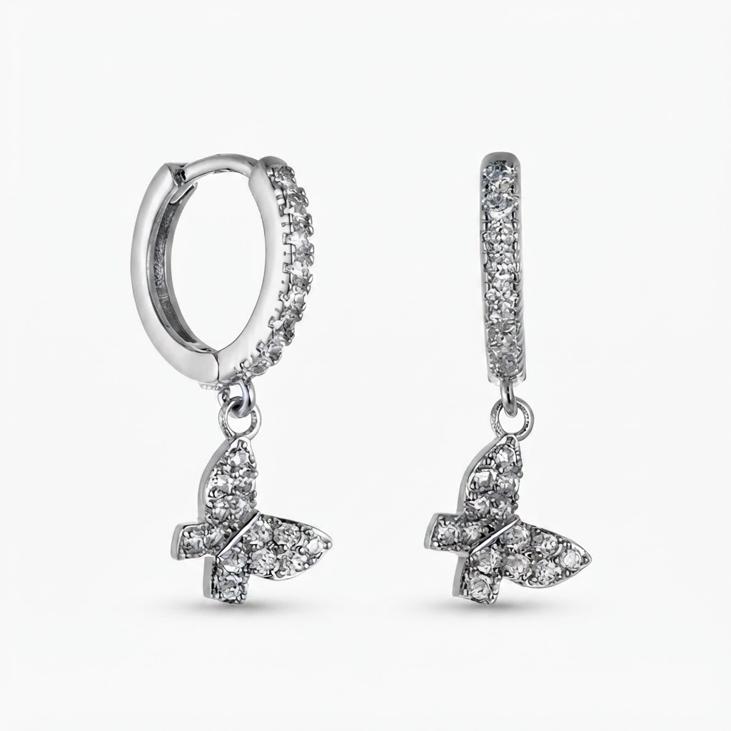 Silver-toned huggie hoop earrings with pavé crystal stones and dangling butterfly charm - elegant small hinged hoop earrings with crystal butterfly pendant - jewelry product photo