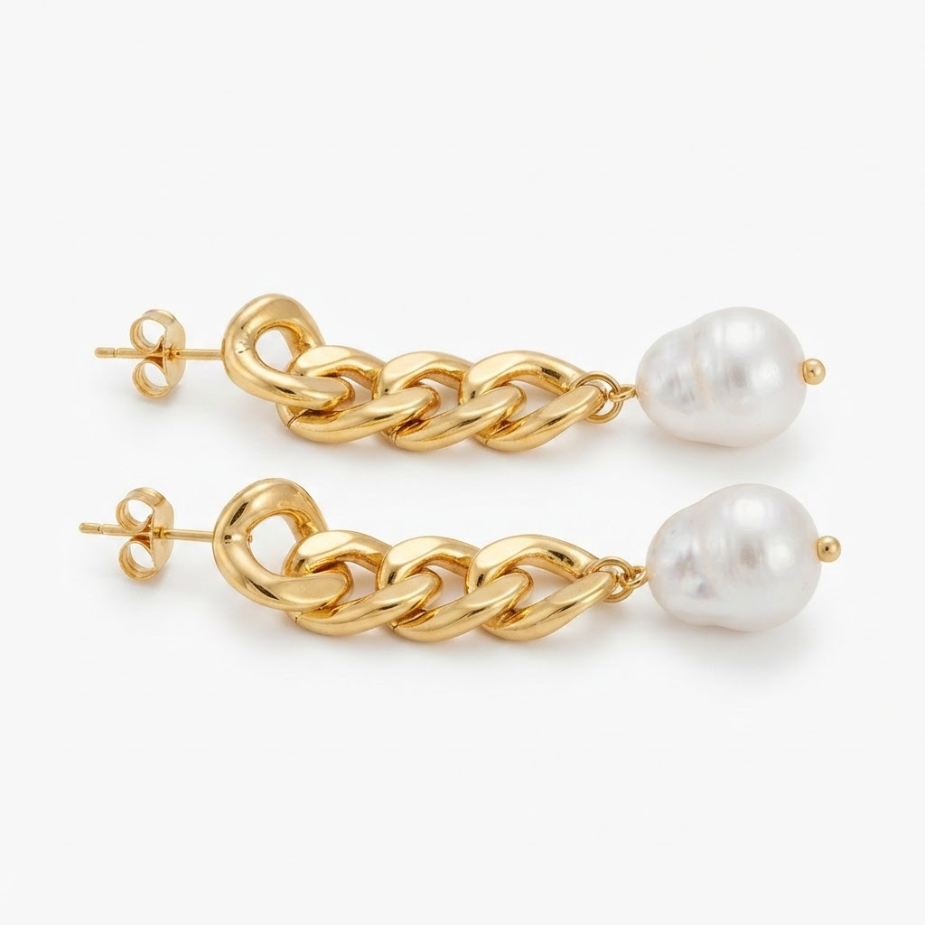 Gold-toned chunky chain link earrings with baroque faux pearl detail - luxury bold curb chain earrings with pearl drop - close-up product photography
