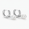 Silver-toned chunky huggie hoop earrings with baroque faux pearl drop - elegant thick hoop earrings with lustrous pearl pendant - jewelry product photo