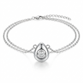 Silver-toned puffy teardrop pendant with rotating crystal detail – three-dimensional organic droplet with movable bezel-set crystal in circular concave setting – extreme macro close-up product photograph