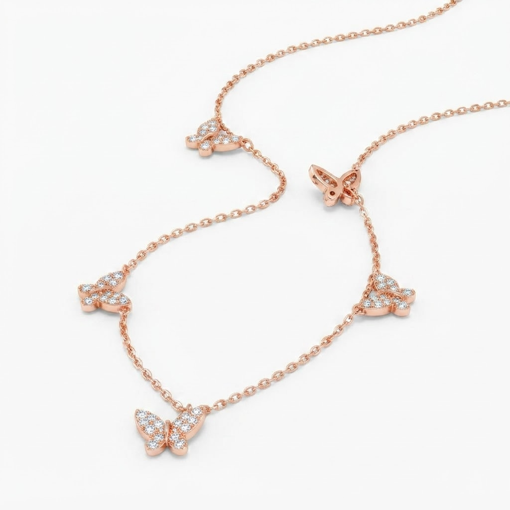 Rose gold-toned butterfly necklace with crystal accents detail - luxury station necklace with five butterfly charms - close-up product photography

