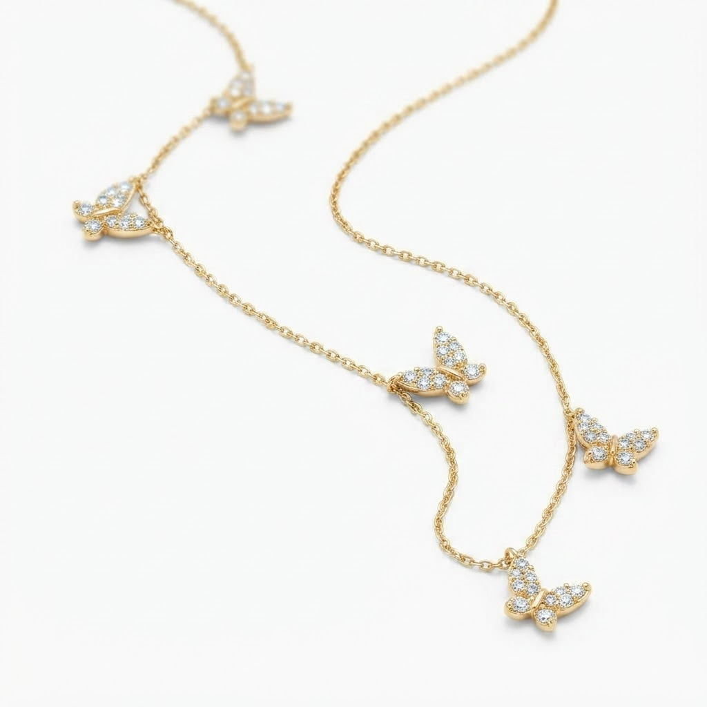 Gold-toned butterfly necklace with crystal accents detail - luxury station necklace with five butterfly charms - close-up product photography
