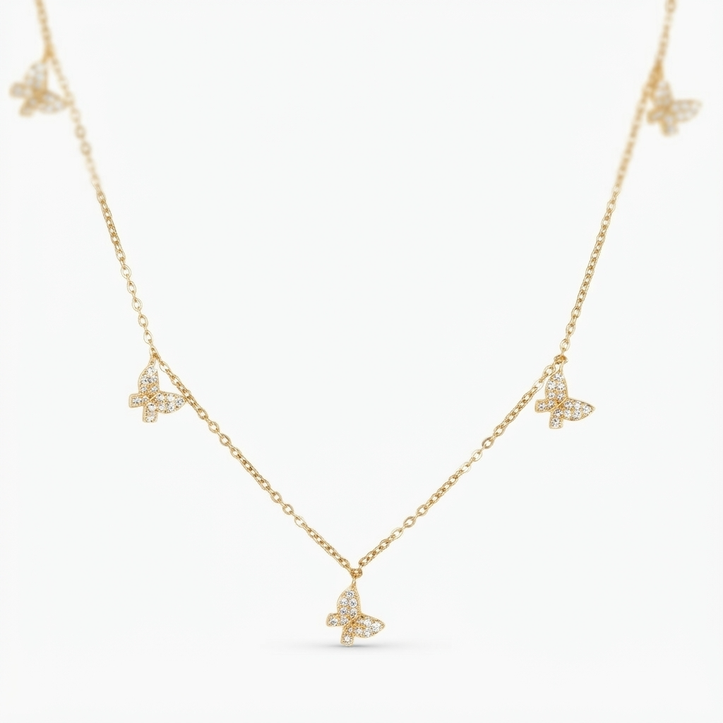 Gold-toned delicate chain necklace with crystal butterfly charms - elegant station style necklace with pavé crystal butterflies - jewelry product photo
