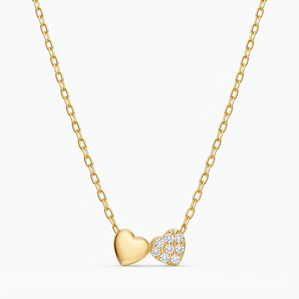 Gold-toned delicate chain necklace with double heart pendant - one solid heart and one crystal pavé heart - elegant romantic jewelry product photo
