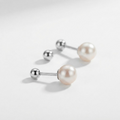 Silver-toned double-sided pearl barbell stud earrings - elegant front-back earrings with silver ball and faux pearl - jewelry product photo
