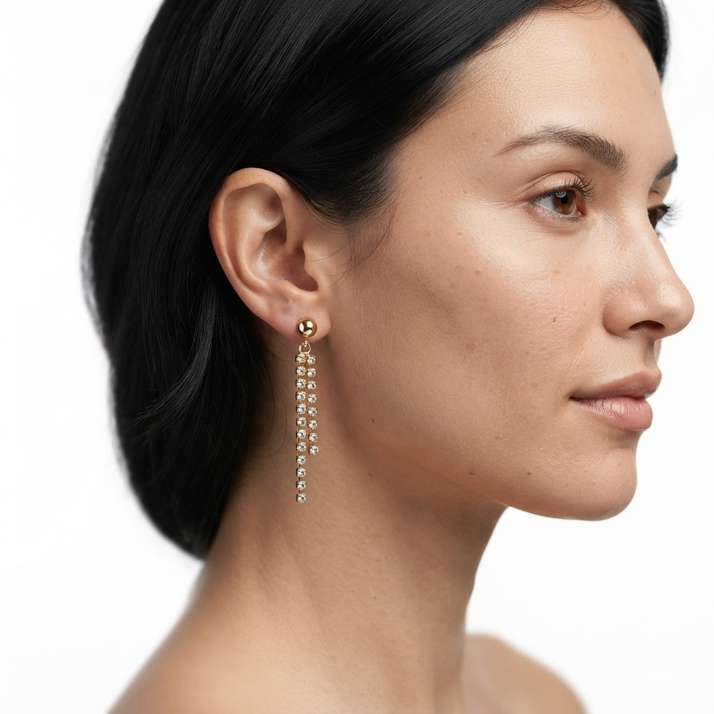 Woman wearing gold-toned ball stud earrings with double crystal fringe drops - elegant crystal dangle earrings styling photo - luxury jewelry lifestyle photography
