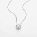 Close-up of silver color stainless steel faux pearl flower pendant necklace – Velara