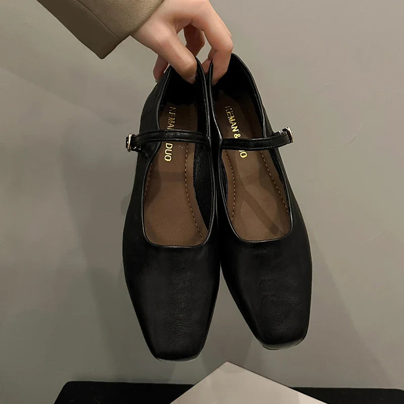 Black low heel mules, pair front view
