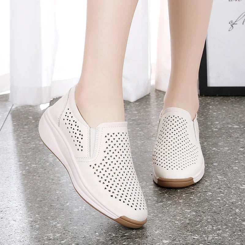 Model wearing white platform shoes, close-up