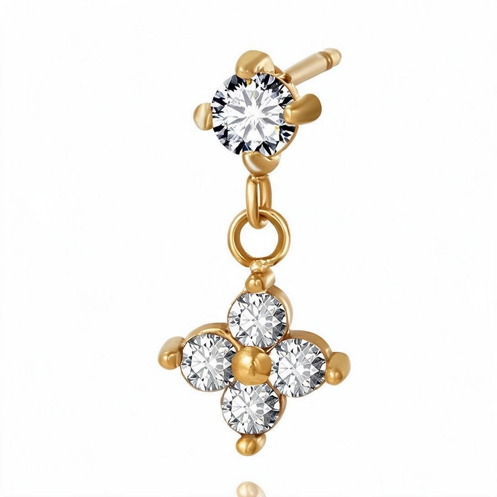 Macro close-up of gold-tone flower CZ dangle earring with four prong settings and center bead