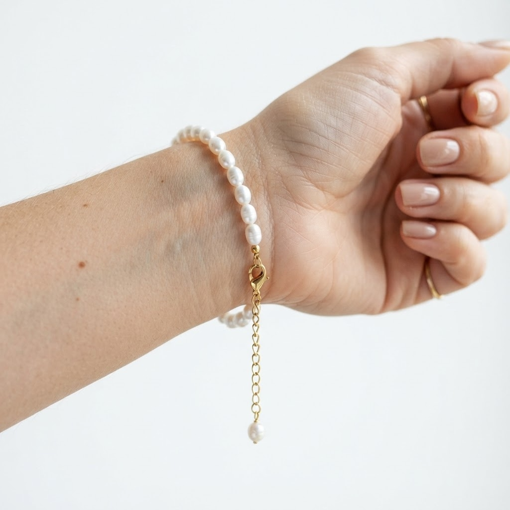 Woman wearing white faux pearl bracelet with gold hardware – elegant classic pearl bracelet with 37 lustrous pearls styling photo – luxury jewelry lifestyle photography