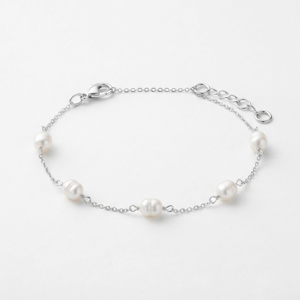 Silver-toned pearl bracelet detail – 5mm baroque freshwater pearl wire-wrapped on rectangular cable chain – extreme close-up product photography