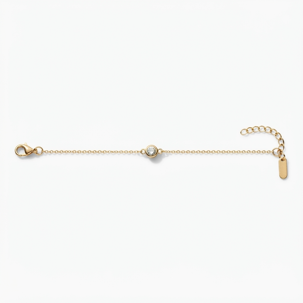 Gold-toned delicate cable chain bracelet with single bezel-set crystal charm – elegant adjustable bracelet 16cm plus 5cm extender with centered round bezel crystal – jewelry product photo