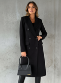 Black double-breasted wool coat with matching handbag