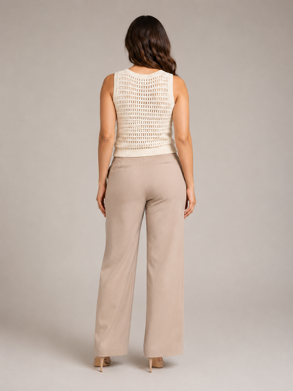Crochet waistcoat styled over a top