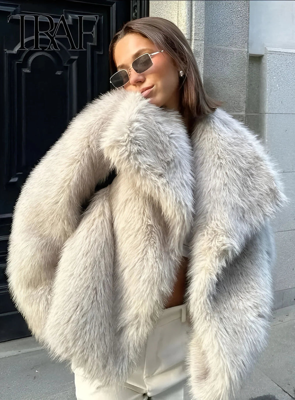 Beige faux fur jacket worn outdoors