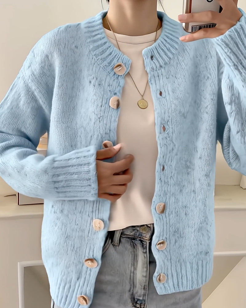 Blue knitted cardigan close-up detail