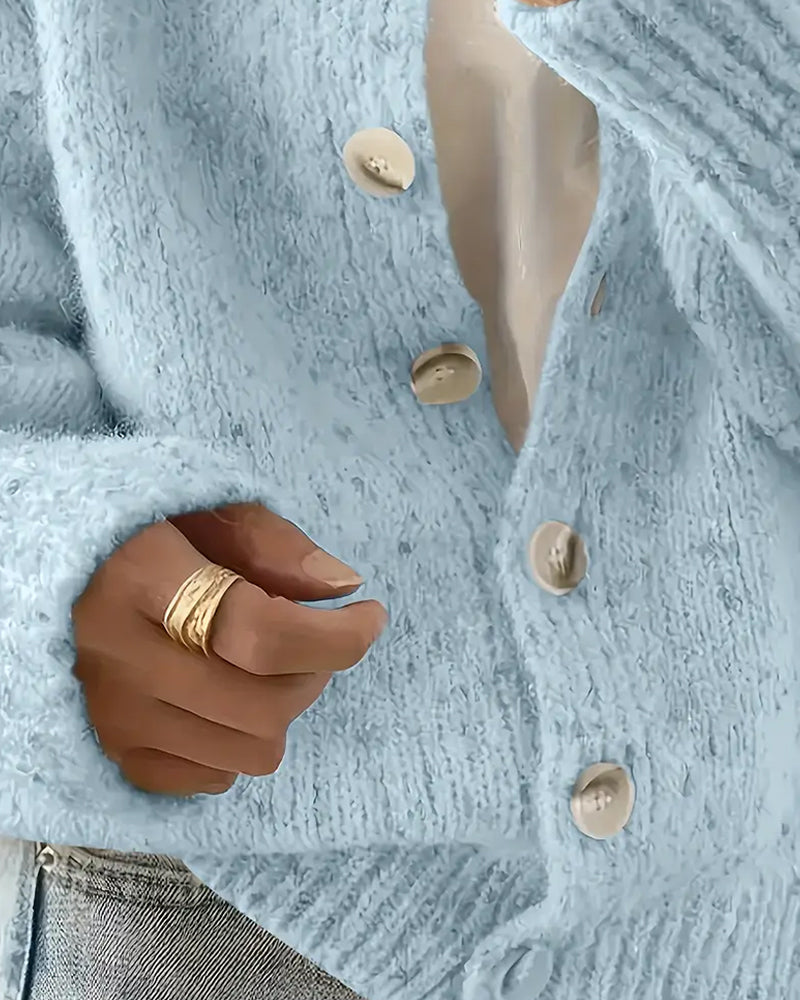 Blue knitted cardigan buttoned front detail