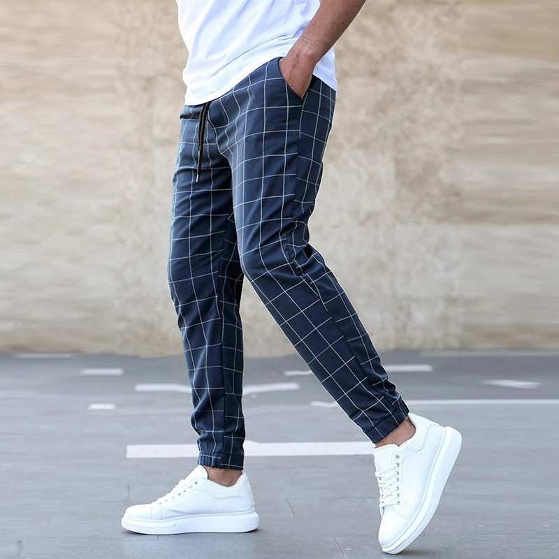 Checked trousers styled with shirt and loafers
