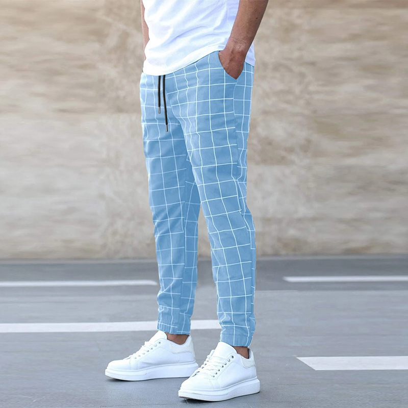 Checked trousers paired with T-shirt and sneakers