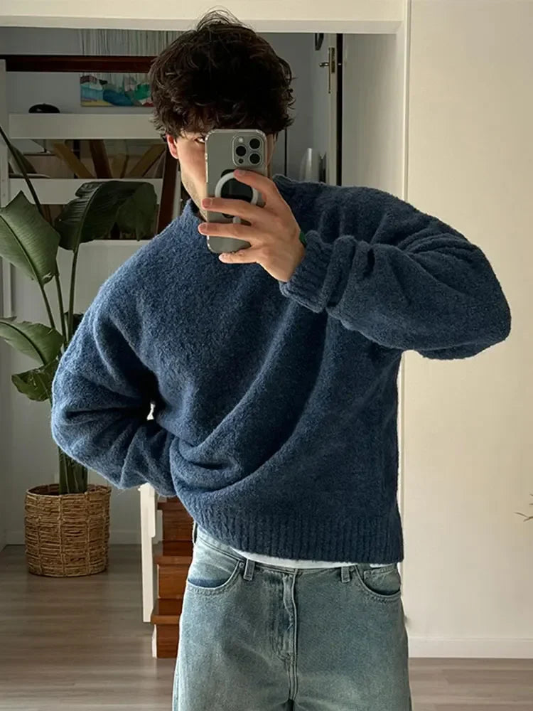 Blue knitted crew neck jumper front view