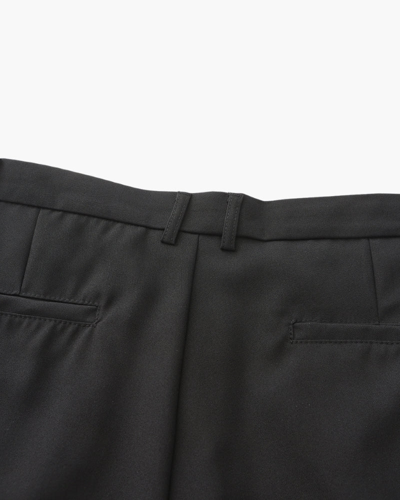 Close-up of trouser pleats and waistband
