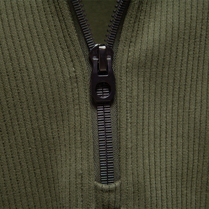 Quarter-zip jumper folded flat lay