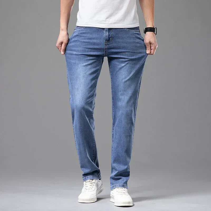 Men's denim jeans styled with shirt and loafers