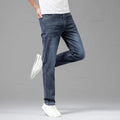 Men's stretch jeans paired with T-shirt and trainers