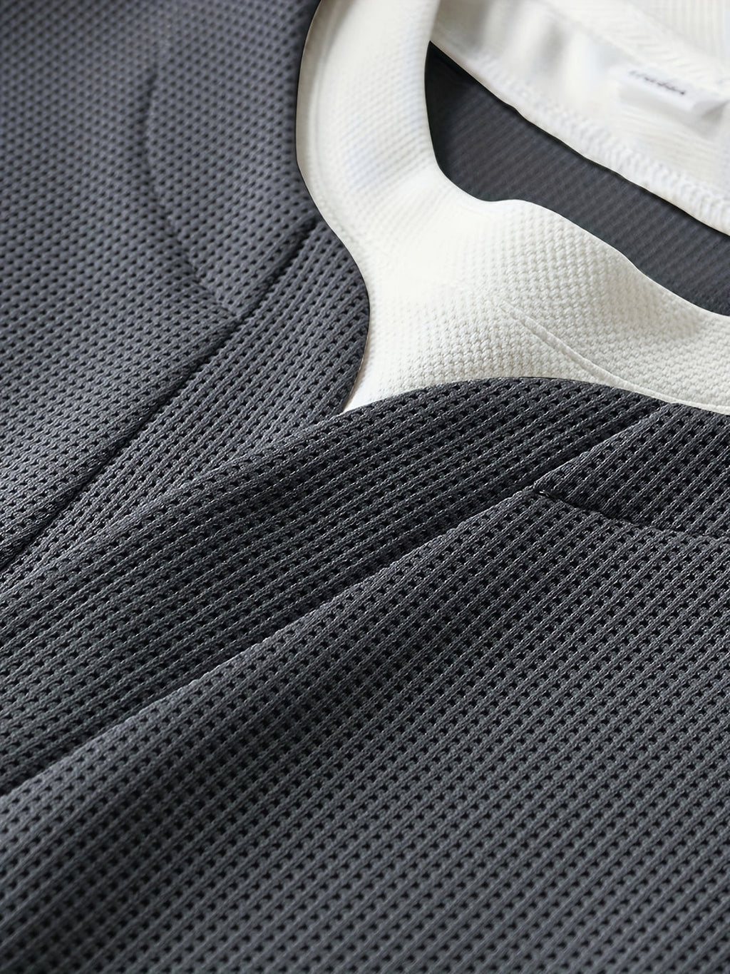 Waffle knit jumper sleeve close-up