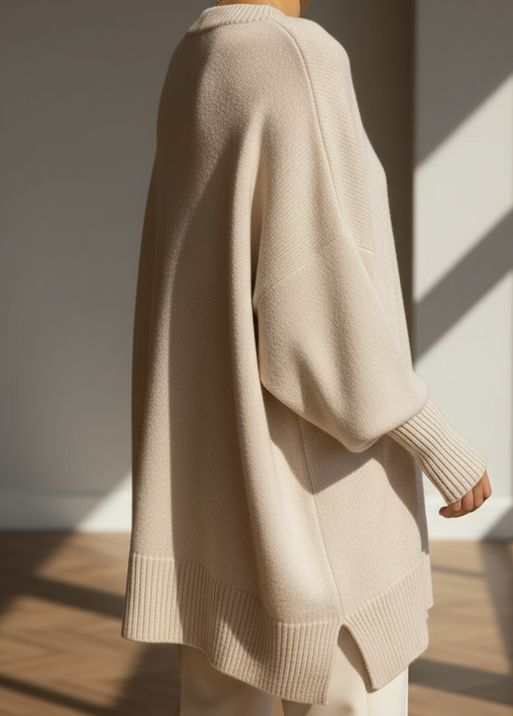 Oversized knit jumper styled with jeans