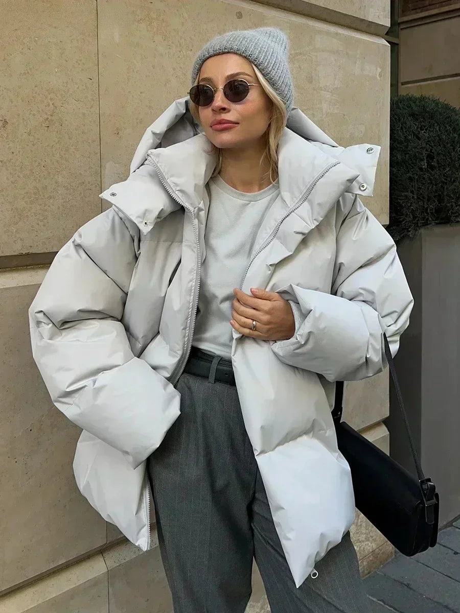 Model wearing oversized hooded winter coat