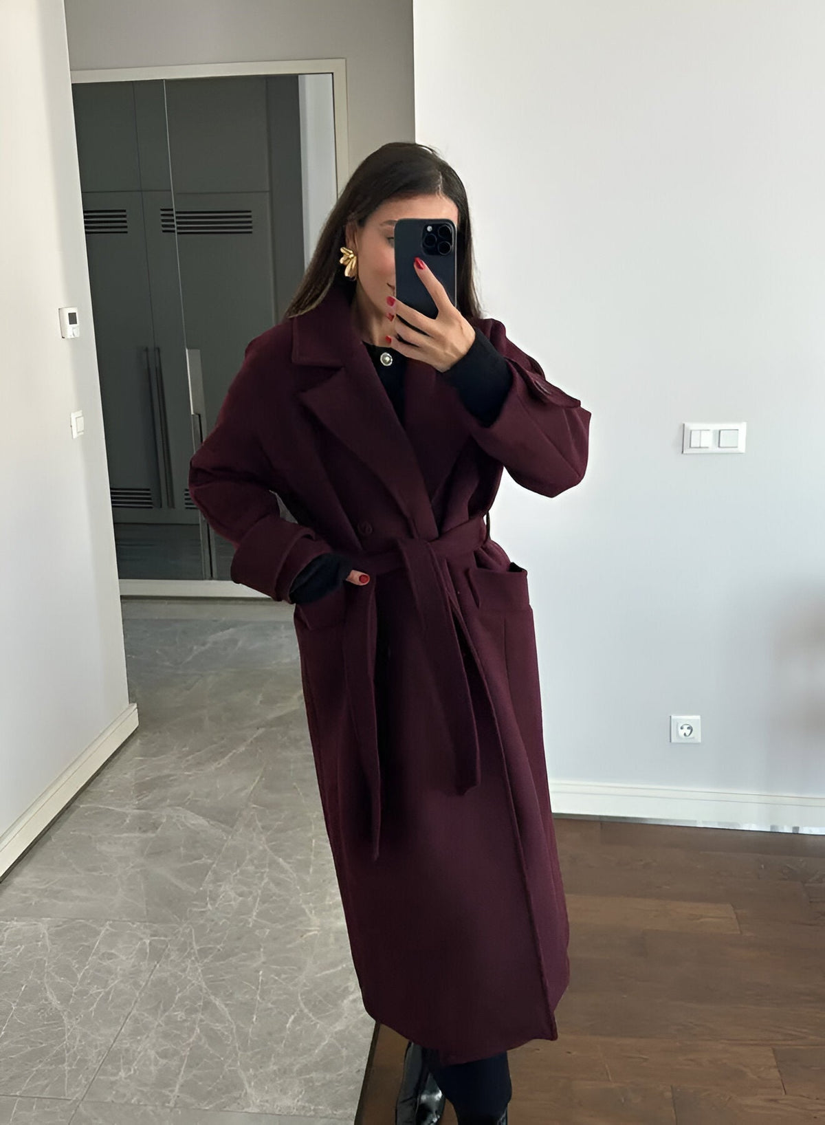 Full length view of burgundy coat