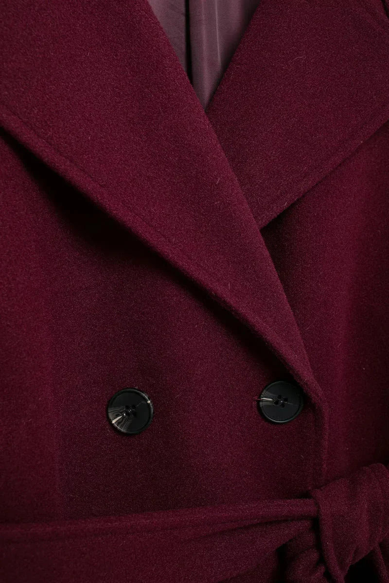 Burgundy coat side view showing oversized fit