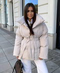 Padded parka coat with belted waist front view