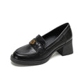 Black penny loafer with heel, front view