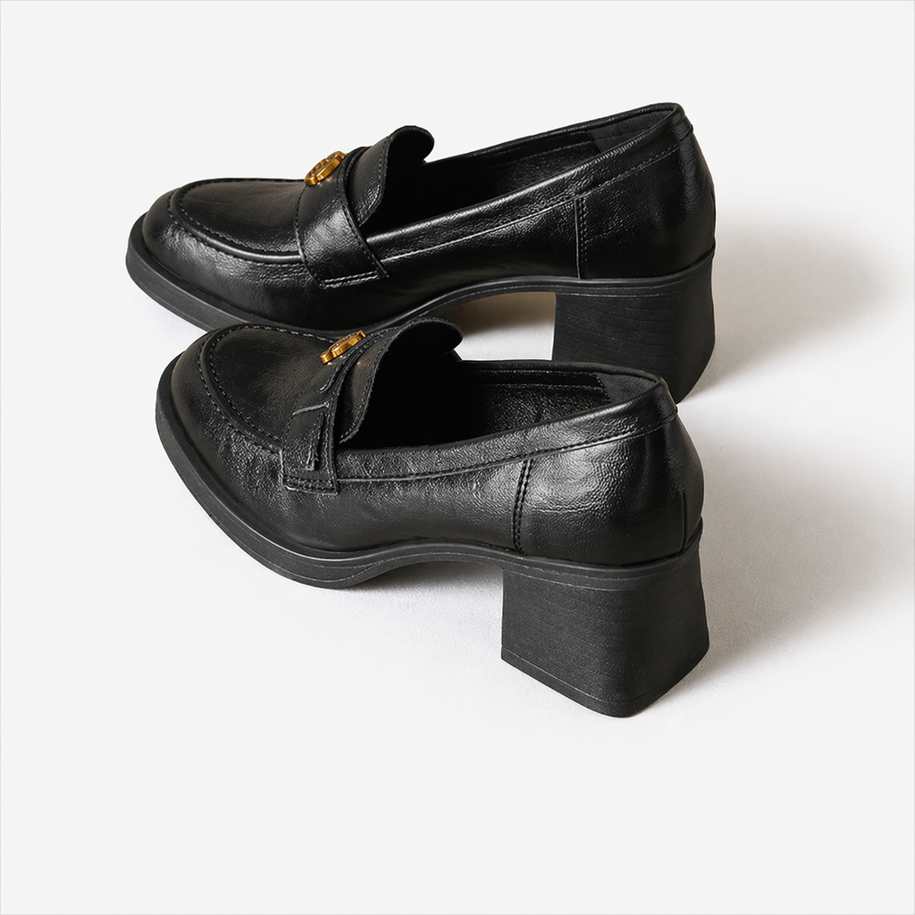 Black penny loafer with heel, side view